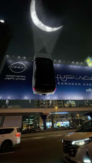 Car Suspended on Bilboard in Dubai in a fake-out-of-home ad of Nissan