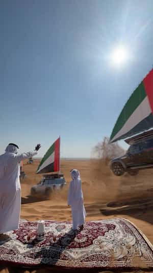 Cars with UAE Flags Drifting on Dunes in a fake-out-of-home ad of Nissan