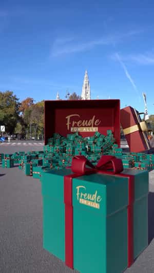 Green Gift Boxes Spilled in a fake-out-of-home ad of Tchibo