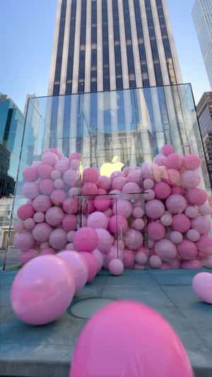 Giant pink balls rolling in NYC fake-out-of-home ad of Apple