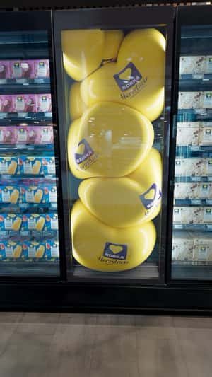Chips Tumble Out From the Fridge in a fake-out-of-home ad of EDEKA