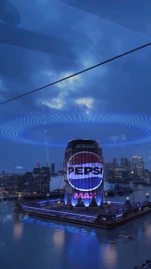 Inflatable Pepsi can rising from London fake-out-of-home ad of Pepsi
