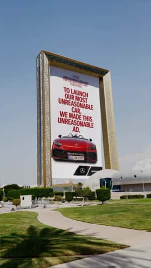 Poster Rolls Down in Dubai Landmark in a fake-out-of-home ad of Mercedes-AMG  