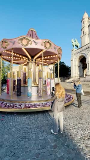 Perfume Carousel Outside the Church in a fake-out-of-home ad for Adopt Parfums