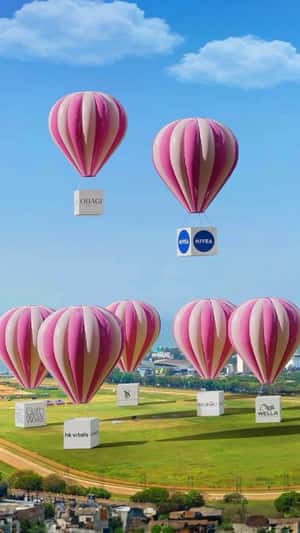 Parachute with Branded Boxes Descend in a fake-out-of-home ad of Nykaa