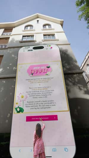 Massive Smartphone Leaning on a Building in a fake-out-of-home ad of Nykaa