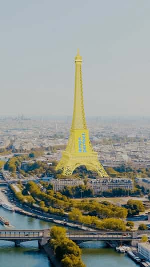 Eiffel Tower Turns Lemon Yellow Hue in a fake-out-of-home ad of Lemon Perfect