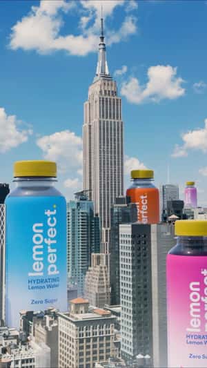 Bottles Emerging Beside Skyscrapers in a fake-out-of-home ad of Lemon Perfect
