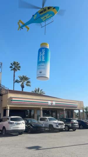 Helicopter Drops Bottle in a fake-out-of-home ad of Lemon Perfect