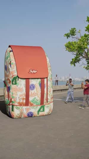 Massive Backpack Stands at Promenade in a fake-out-of-home ad of Skybags