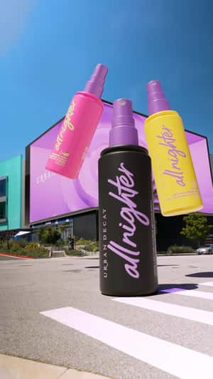 Setting Sprays Emerge from 3D Screen in a fake-out-of-home ad of Urban Decay