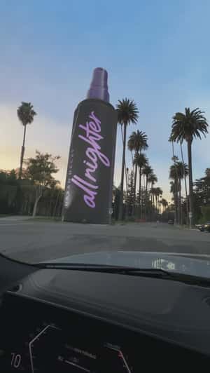 Setting Spray Stands Along Palm Trees in a fake-out-of-home ad of Urban Decay