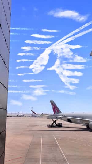 Qatar Airways logo in the sky fake-out-of-home ad of Qatar Airways