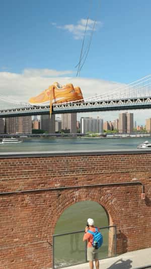 Sneakers Dropped on the Bridge in a fake-out-of-home ad of Foot Locker