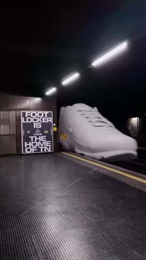 Shoes Line Up Like Train Wagons in a fake-out-of-home ad of Foot Locker