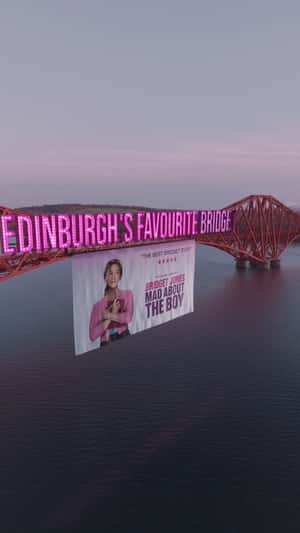 Poster Hangs on the Bridge in a fake-out-of-home ad of Universal Pictures