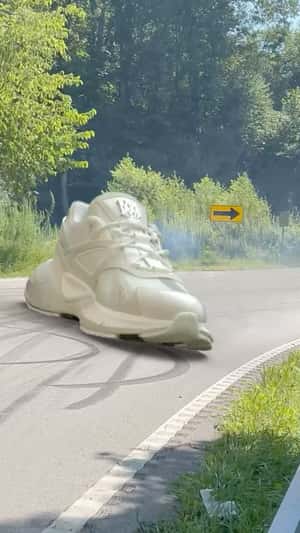 Running Shoes Racing in a fake-out-of-home of AMIRI