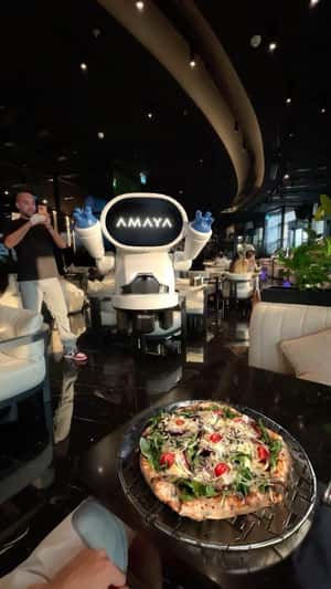 Flying Robot Serves Pizza in a fake-out-of-home ad of Amaya