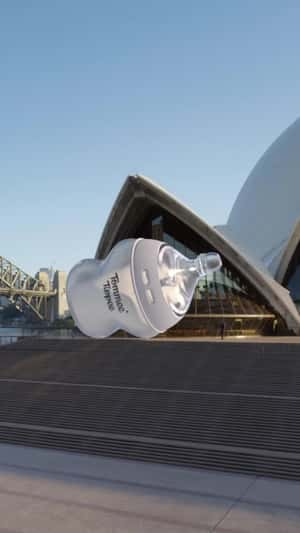 Baby Bottle Rolling at Opera House in a fake-out-of-home-ad of Tommee Tippee