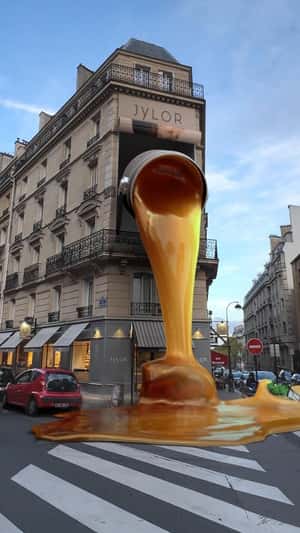 Golden Cream Poured on Street in a fake-out-of-home-ad of Jylor