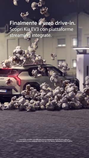Popcorn Drops Above Charging SUV in a fake-out-of-home ad of Kia