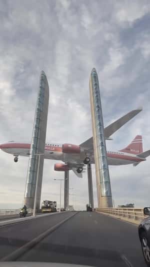 Suspended Plane Above the Bridge in a fake-out-of-home ad of Quoifaireabordeaux