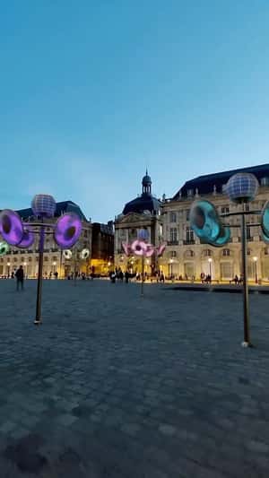 Rotating Neon Fans on Lamp Post in a fake-out-of-home ad of Quoifaireabordeaux