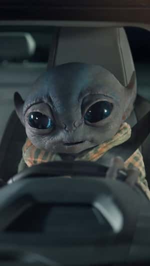 Alien Driving a Car on Highway in a fake-out-of-home ad of Citroën