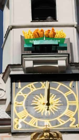 Chicken and Fries Revealed at Town Hall in a fake-out-of-home ad of Żabka