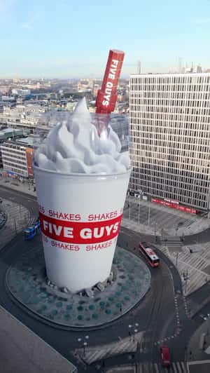 Milkshake Towering at Roundabout in a fake-out-of-home ad of Five Guys