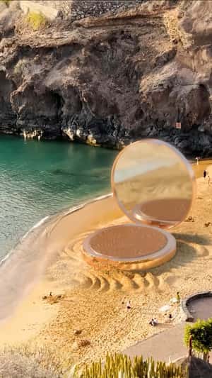 Compact Powder Emerges on the Beach in a fake-out-of-home ad of H&M Beauty