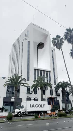 Golf Club Revealed at Building’s Façade in a fake-out-of-home ad of LA GOLF