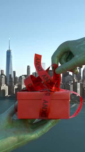 Statue of Liberty Unwraps Gift Box n a fake-out-of-home ad of DKNY