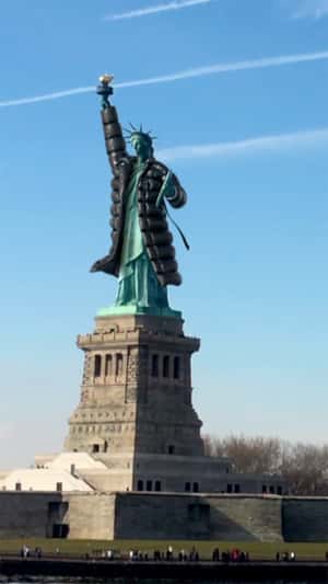 Statue of Liberty Wearing Trench Coat in a fake-out-of-home ad of DKNY