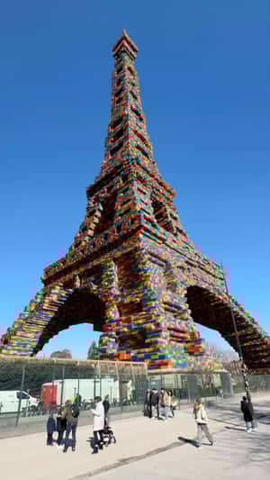 Eiffel Tower Covered with LEGO Bricks in a fake-out-of-home ad of LEGO