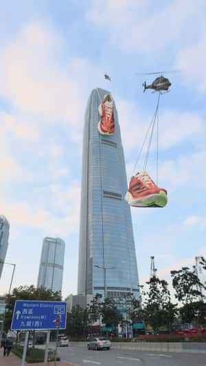 Running Shoes Spotted On Top Of Building in a fake-out-of-home ad of Adidas