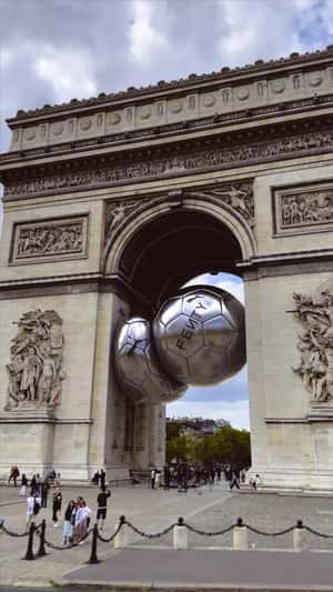 Soccer Balls Stuck in Different Landmarks in a fake-out-of-home ad of PUMA