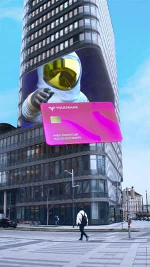 Card Emerges From Digital Screen in a fake-out-of-home ad of Volksbank