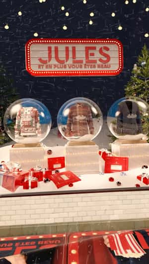 Christmas Collection Display on Snow Globe in a fake-out-of-home ad of JULES