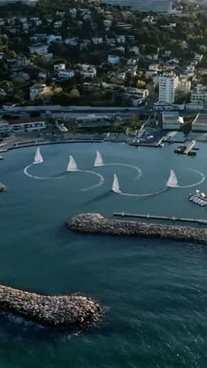 Sailboats Forming Olympic Logo in a fake-out-of-home ad of Ville de Marseille