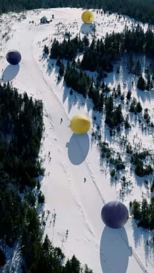 Christmas Balls Racing on Ski Park in a fake-out-of-home ad of Club Med