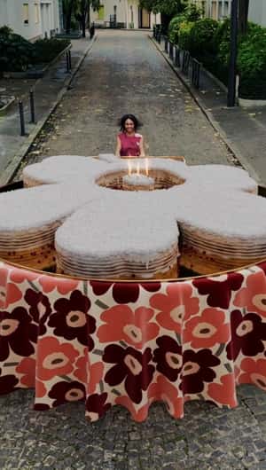 Woman Pushing Flower Cake in a fake-out-of-home ad of Marimekko