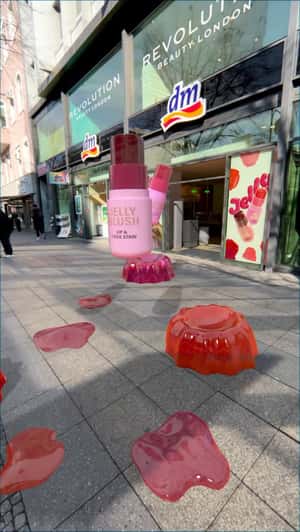 Jelly Blush Sticks Jumps Over Fallen Jellies in a fake-out-of-home ad of DM