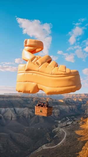 Sandal Hot Air Balloon Glides Above the Canyon in a fake-out-of-home ad of UGG