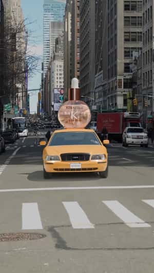 Oil Drops Bottle Rides Above the Taxi in a fake-out-of-home ad of Kérastase