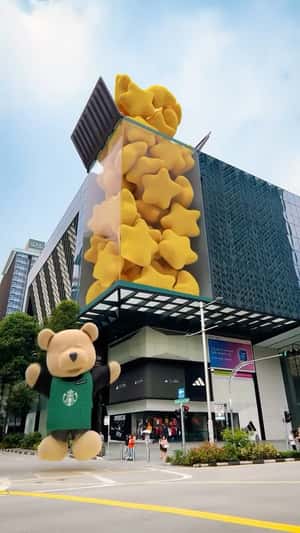 Plush Stars Floats at the Building in a fake-out-of-home ad of Starbucks