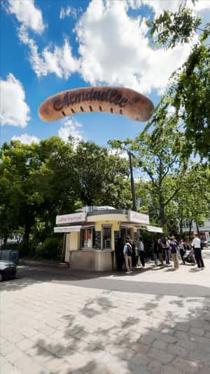 Giant Sausage in fake-out-of-home ad of Almdudler