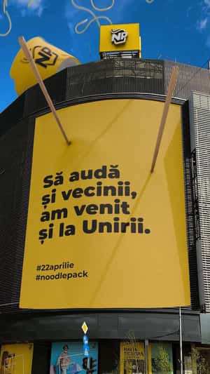 Noodles Hanging on Chop Sticks in a fake-out-of-home ad of Noodle Pack