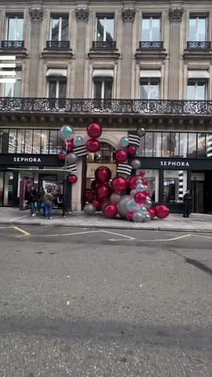 Christmas Balls Rolling Towards the Store in a fake-out-of-home ad of Sephora