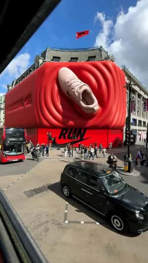Running Shoe Stomping on 3D Billboard in a fake-out-of-home ad of Nike